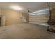 Garage with overhead door, concrete floor, and ample space at 1067 Haines Dr, Winter Haven, FL 33881