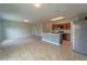 Open concept kitchen with island, stainless steel appliances, and neutral colors at 1067 Haines Dr, Winter Haven, FL 33881