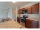 Modern kitchen with stainless steel appliances and wood cabinets at 1067 Haines Dr, Winter Haven, FL 33881