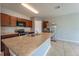 Modern kitchen with stainless steel appliances and dark brown cabinets at 1067 Haines Dr, Winter Haven, FL 33881