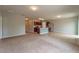 Open concept kitchen with island, stainless steel appliances, and neutral colors at 1067 Haines Dr, Winter Haven, FL 33881