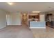 Open concept kitchen with island, stainless steel appliances, and neutral colors at 1067 Haines Dr, Winter Haven, FL 33881