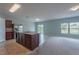 Open kitchen with island, stainless steel appliances, and light-colored cabinetry at 1067 Haines Dr, Winter Haven, FL 33881