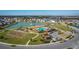 Aerial view of community pool, park, and lake at 113 Eagleview Loop, Davenport, FL 33837