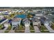 Aerial view of houses, pond, and community at 113 Eagleview Loop, Davenport, FL 33837