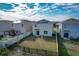 Aerial view of houses with solar panels and backyard at 113 Eagleview Loop, Davenport, FL 33837