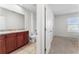 Bathroom with double sinks, tub, and toilet at 113 Eagleview Loop, Davenport, FL 33837