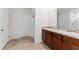 Double sink bathroom with a linen closet at 113 Eagleview Loop, Davenport, FL 33837