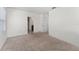 Spacious bedroom with neutral carpeting and large windows at 113 Eagleview Loop, Davenport, FL 33837