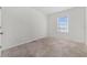 Well-lit bedroom featuring neutral walls and carpet at 113 Eagleview Loop, Davenport, FL 33837