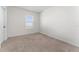Bright bedroom with carpeted floors and a window at 113 Eagleview Loop, Davenport, FL 33837