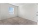 Simple bedroom with carpet and a window at 113 Eagleview Loop, Davenport, FL 33837