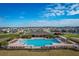 Community pool with surrounding lounge area at 113 Eagleview Loop, Davenport, FL 33837