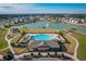 Community pool with lounge chairs and cabana at 113 Eagleview Loop, Davenport, FL 33837