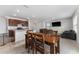 Kitchen and dining area with wooden table and chairs at 113 Eagleview Loop, Davenport, FL 33837