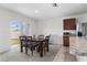 Dining area with wooden table and access to patio at 113 Eagleview Loop, Davenport, FL 33837