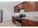 Modern kitchen features stainless steel appliances and ample cabinetry at 113 Eagleview Loop, Davenport, FL 33837