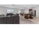 Open kitchen with stainless steel appliances and island at 113 Eagleview Loop, Davenport, FL 33837