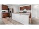 Modern kitchen with stainless steel appliances and island at 113 Eagleview Loop, Davenport, FL 33837