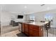 Open kitchen with island and view into living room at 113 Eagleview Loop, Davenport, FL 33837