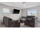 Living room with grey sofas and large TV at 113 Eagleview Loop, Davenport, FL 33837