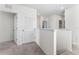 Upper hallway with doors to bedrooms and a linen closet at 113 Eagleview Loop, Davenport, FL 33837