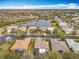 Aerial view of homes near a lake in a quiet residential community at 119 Verona Dr, Kissimmee, FL 34759