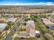 Aerial view of residential neighborhood with houses and surrounding landscape at 119 Verona Dr, Kissimmee, FL 34759