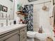 Updated bathroom with tub, vanity, and patterned shower curtain at 119 Verona Dr, Kissimmee, FL 34759