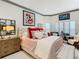 Charming bedroom with a comfy bed, decorative pillows, and large windows at 119 Verona Dr, Kissimmee, FL 34759