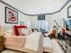Bright bedroom featuring a cozy bed, stylish decor, and ample natural light at 119 Verona Dr, Kissimmee, FL 34759