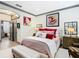 Elegant bedroom with a luxurious bed, decorative artwork, and ensuite bathroom access at 119 Verona Dr, Kissimmee, FL 34759