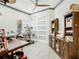 Well-lit craft room featuring sewing machine, desk, and ample storage at 119 Verona Dr, Kissimmee, FL 34759