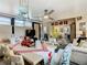 Bright and cheerful sunroom dining area with playful decor at 119 Verona Dr, Kissimmee, FL 34759
