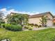 Well-maintained house with lush landscaping and a two-car garage at 119 Verona Dr, Kissimmee, FL 34759