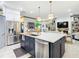 Open concept kitchen with island and stainless steel appliances at 119 Verona Dr, Kissimmee, FL 34759