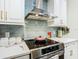 Kitchen with stainless steel appliances and light blue backsplash at 119 Verona Dr, Kissimmee, FL 34759