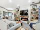 Living room features a fireplace, TV, and comfortable seating at 119 Verona Dr, Kissimmee, FL 34759