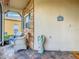 Relaxing screened porch with wicker chairs and stone accents at 119 Verona Dr, Kissimmee, FL 34759