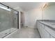 Modern bathroom with walk-in shower and double vanity at 1210 Michelangelo Ln, Winter Haven, FL 33884