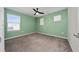 Spacious bedroom with ceiling fan and neutral wall colors at 1210 Michelangelo Ln, Winter Haven, FL 33884