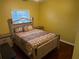 Bedroom with a double bed and wood floors at 1427 Pacific Rd, Kissimmee, FL 34759