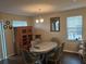 Dining room with table, chairs, and wood floors at 1427 Pacific Rd, Kissimmee, FL 34759