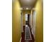 Bright hallway with wood flooring and neutral walls at 1427 Pacific Rd, Kissimmee, FL 34759