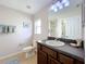 Clean bathroom with single sink vanity and shower/tub combo at 154 Robin Rd, Davenport, FL 33896