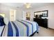 Bedroom with ensuite bathroom and a view of the living room at 154 Robin Rd, Davenport, FL 33896
