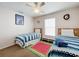 Bedroom with two twin beds, featuring playful decor at 154 Robin Rd, Davenport, FL 33896