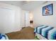 Bright bedroom with two twin beds and closet at 154 Robin Rd, Davenport, FL 33896