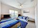 Bedroom with two twin beds, and blue bedding at 154 Robin Rd, Davenport, FL 33896