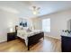 Spacious bedroom with wood flooring and a ceiling fan at 154 Robin Rd, Davenport, FL 33896